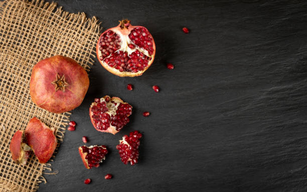 istock Fresh Ripe Organic Pomegranate Fruit with Juicy Seeds 1217641081