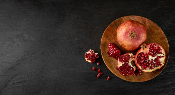 istock Fresh Ripe Organic Pomegranate Fruit with Juicy Seeds 1217641119