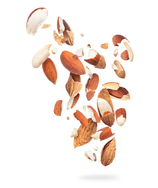 istock Crushed almonds are hanging in the air, isolated on a white background 1217642625