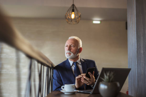istock Senior businessman using a smart phone 1217644289
