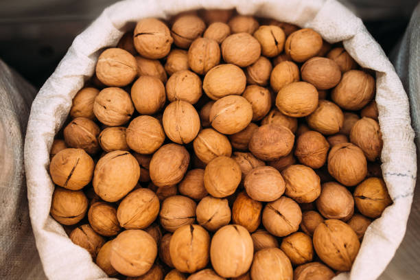istock Walnuts in the bag. Nuts at the fair 1217645340
