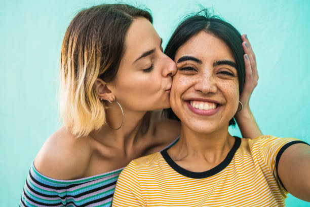 Lovely lesbian couple taking a selfie.