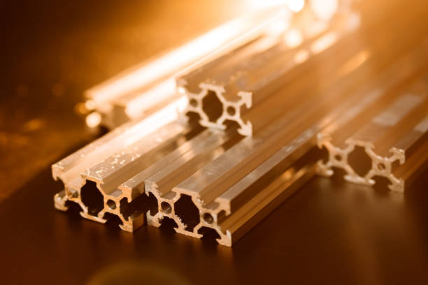 istock v slot aluminum profile lies on a black table, work surface with a bright lantern. how to assemble a cnc machine do it yourself 1217646456