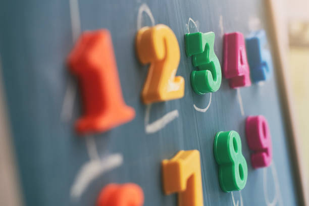 istock Learning numbers on a blackboard with colorful magnets and handwriting on blackboard during homeschooling at quarantine 1217649183