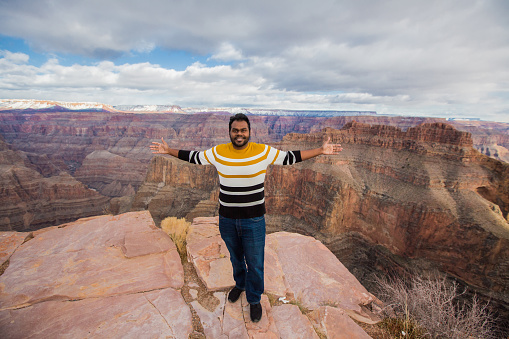 A young adult male (age 31) visits the Grand Canyon as a solo traveler in winter.