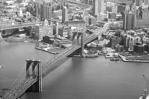 Aerial view of Brooklyn bridge in black and white.