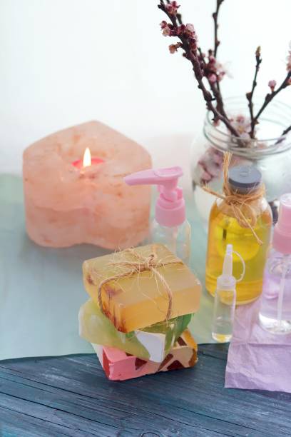 istock Soap, antiseptic liquid, aroma lamp with a lit candle on the windowsill 1217652476