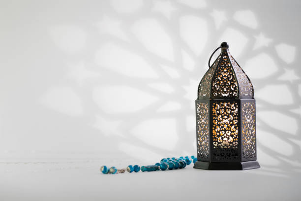 Black lantern with arabesque shadow on background. Photo for religious greeting like  Ramadan month, hajj, Eid, and some traditional Islamic occasions. eid ul fitr photos stock pictures, royalty-free photos & images