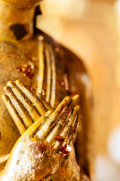 istock Crossed hands buddha statue in Chiang Mai, Thailand 1217653743