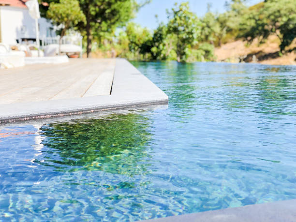 istock Swimming pool water background focus view 1217654490