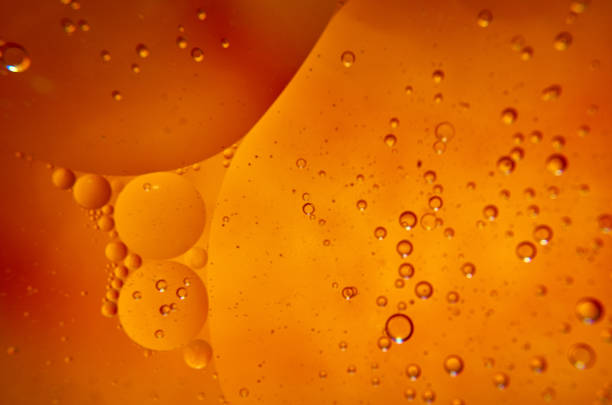 istock Sunflower dark oil bubbles background macro 1217654781