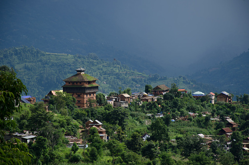 Nuwakot ancient castle tower appears in the morning haze from a hilltop near Nuwakot village, Nepal.