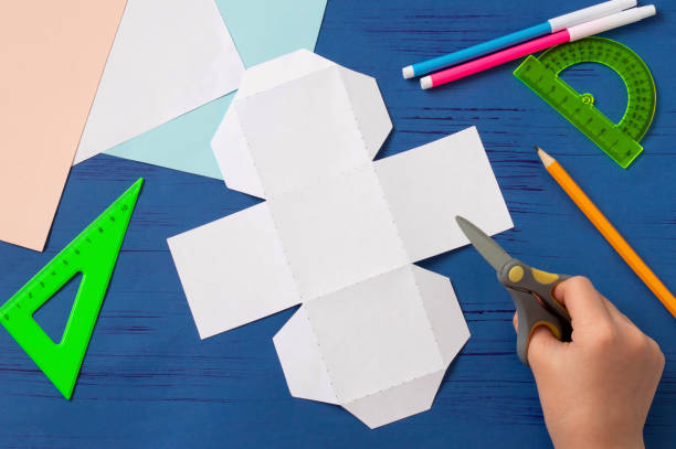 istock Child makes box for sweets in form of Easter Bunny. Step 3 1217658940