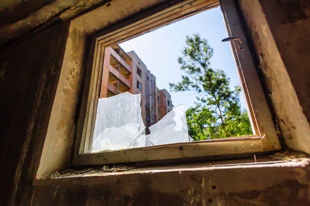 istock Broken glass in window in abandoned building in ghost town Pripyat Chornobyl Zone 1217659065