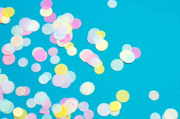 istock Turquoise background with many round multicolored confetti. 1217660594