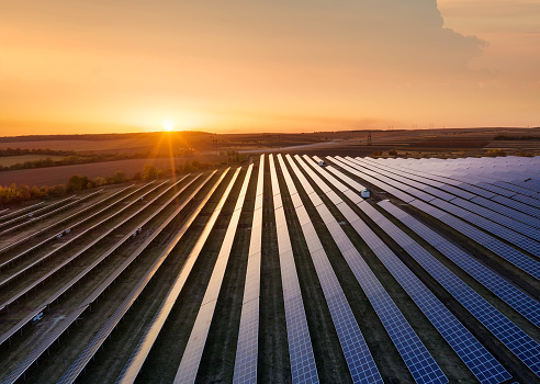 Aerial view on the solar panel. Technologies of renewable energy sources. View from air. Industrial landscape during sunset. Technologi - image