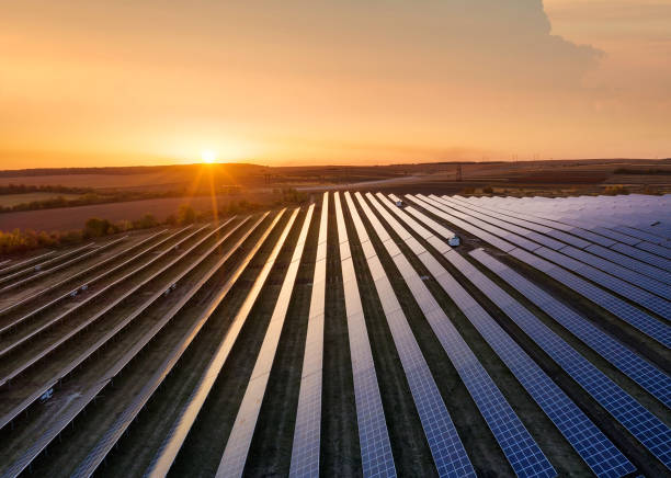 Aerial view on the solar panel. Technologies of renewable energy sources. View from air. Industrial landscape during sunset. Technologi - image stock photo