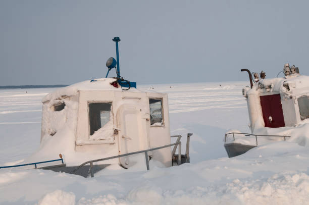istock Old ships in a frozen port 1217661724