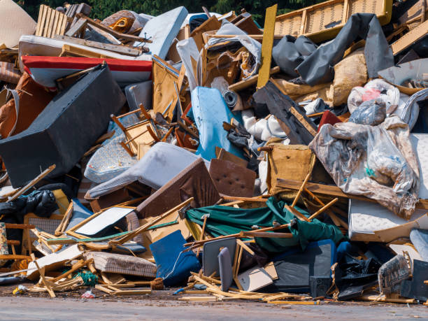 istock Recycling dump with trash of broken chairs, tables, bed and much more. 1217663431