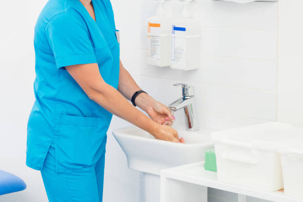 hand washing and sanitizer disinfection. The doctor is preparing to receive patients stock photo