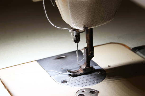 istock 2 Presser foot, needle and thread of the sewing machine 1217669884