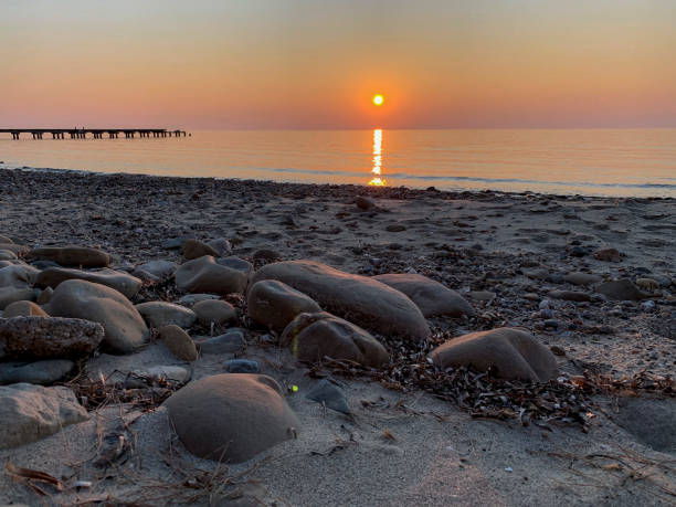 istock Sunset at the rocky shore 1217672460