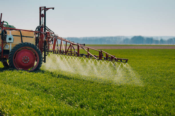istock Tractor Spraying Herbicides on Field Agriculture 1217672960
