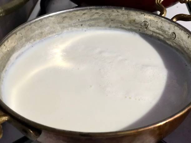 istock Milk is heated in Copper Pan 1217673671