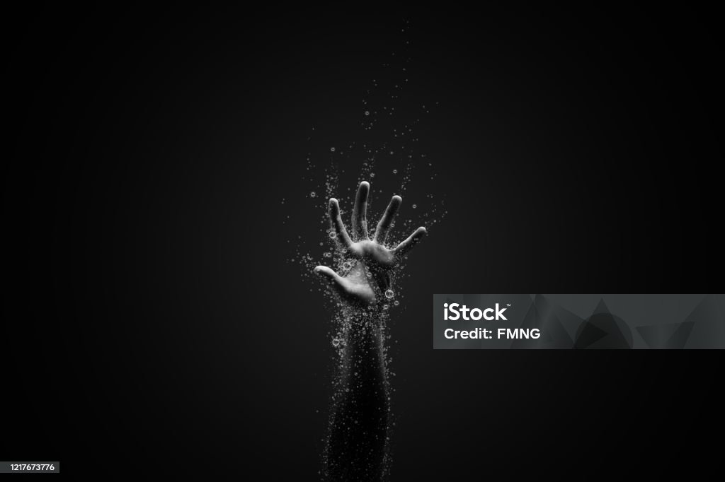 Victim of the virus a hand surrounding with coronavirus, idea, conceptual images. Drowning Stock Photo