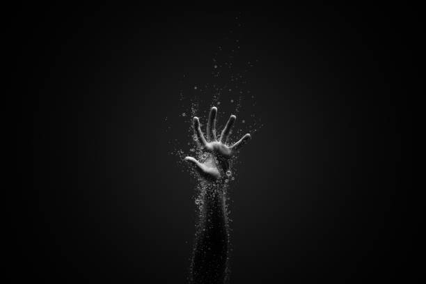 Victim of the virus a hand surrounding with coronavirus, idea, conceptual images. drowning photos stock pictures, royalty-free photos & images