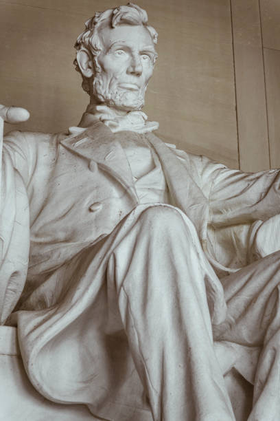 Abraham Lincoln Statue Statue of Abraham Lincoln in Lincoln Memorial. The colossal seated figure of United States President Abraham Lincoln sculpted by Daniel Chester French and carved by the Piccirilli Brothers in 1920. washington dc slavery the mall lincoln memorial stock pictures, royalty-free photos & images