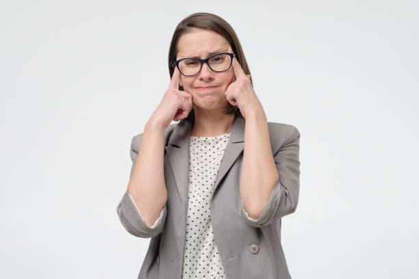 istock female supervise with attractive look, tries to remember something in mind 1217680277