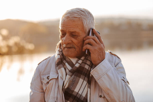 istock Senior man using phone in nature 1217682358
