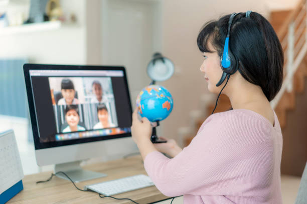 Asian woman teacher teaching geography via video conference e-learning and cheerful elementary school student looking at globe, Homeschooling and distance learning ,online ,education and internet. Asian woman teacher teaching geography via video conference e-learning and cheerful elementary school student looking at globe, Homeschooling and distance learning ,online ,education and internet. epidemiology student stock pictures, royalty-free photos & images