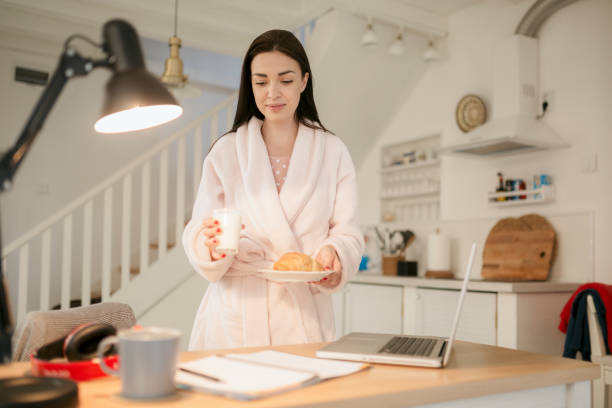 istock Beautiful young woman working casually from home 1217683601