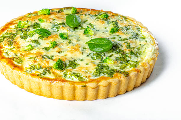 istock white isolated background, pie with basil, red fish, fresh herbs and broccoli 1217683689