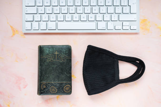 istock Covid-19 christian background. Bible and mask 1217684688