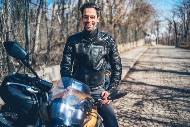 istock Caucasian man with motorbike 1217688699
