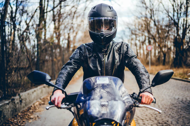 istock Man riding a motorbike 1217689303