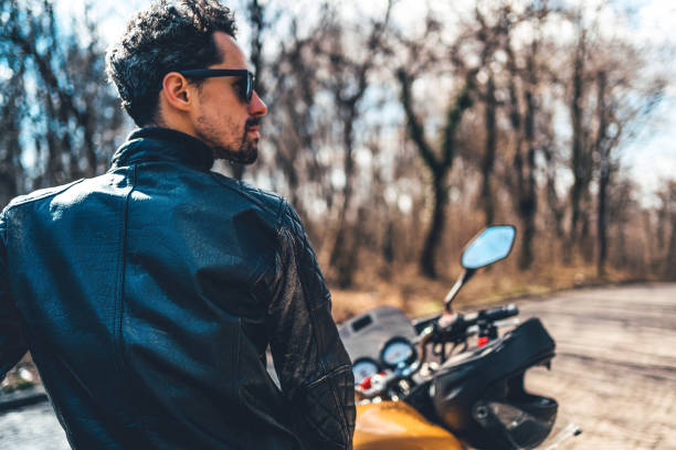 istock Young man on a motorbike 1217689389
