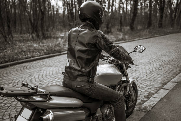 istock Man with helmet on motorcycle 1217690259