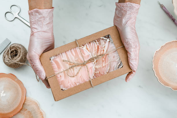 istock Creativity and craft. A young girl creates coasters from resin. Gift wrapping. Decorative packaging. Idea for business. Remote work, work at home. Art coasters. 1217691895