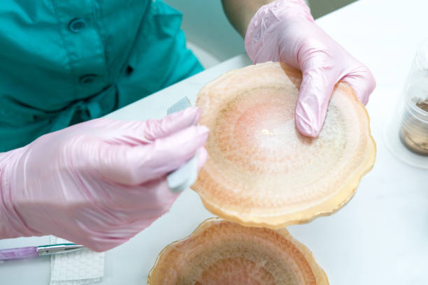 istock Creativity and craft. A young girl creates coasters from resin. Gift wrapping. Decorative packaging. Idea for business. Remote work, work at home. Art coasters. 1217691899