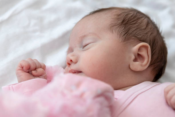 istock Sleeping newborn baby girl 1217692464