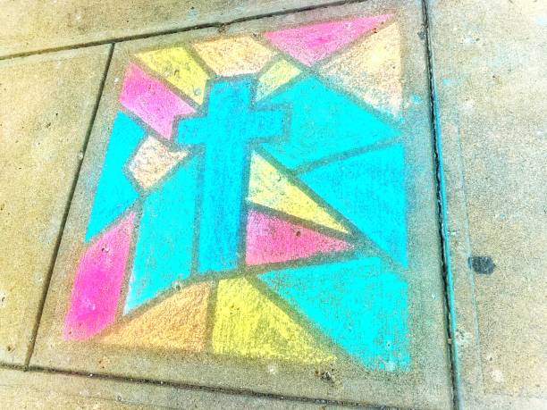 istock Sidewalk chalk drawing stained glass cross Easter 1217692739
