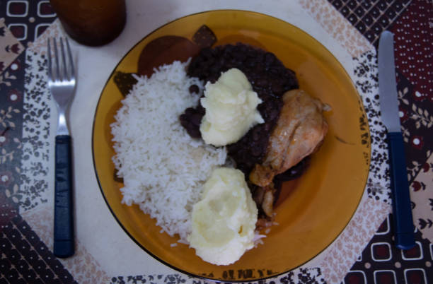 istock Plate of rice and beans with chicken 1217692777