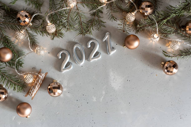 istock New Year 2021 silver balloons with fireworks 1217692827