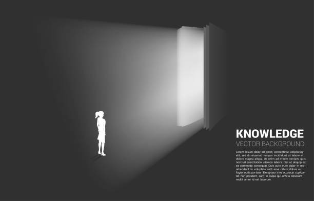 istock Silhouette of businesswoman standing in light from open book. 1217694277