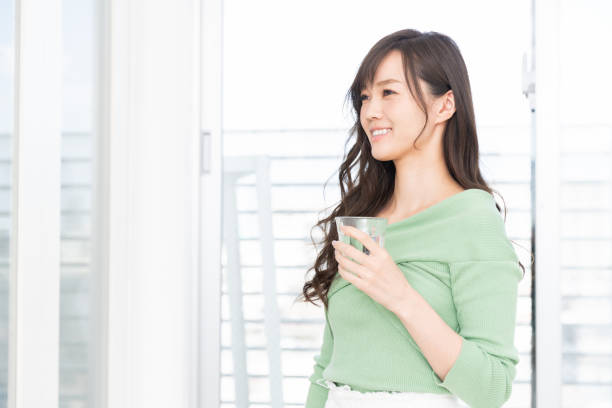 istock asian woman who drinks water 1217695948