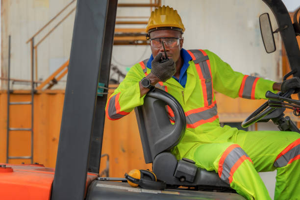 istock industial background of african american forklift driver driving forklift a loading area at containers yard and cargo 1217696718